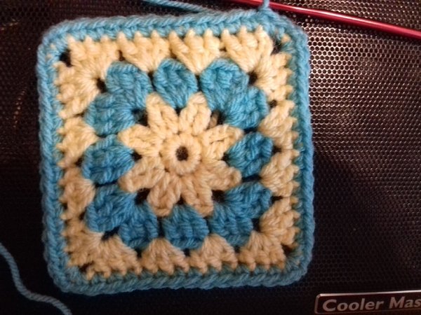 Two granny square patterns with flower