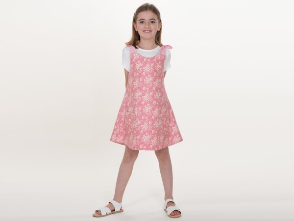 Multi-seasonal girls dress sewing pattern with bow, pocket, reversible